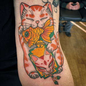 Hình Xăm Mèo Thần Tài Cá Chép: Biểu Tượng May Mắn Độc Đáo Trong Nghệ Thuật Xăm